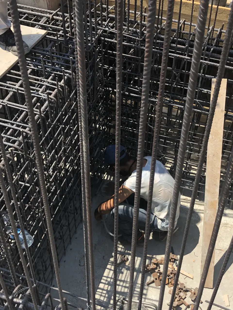 Timoleon site team fixing reinforcement in the foundations