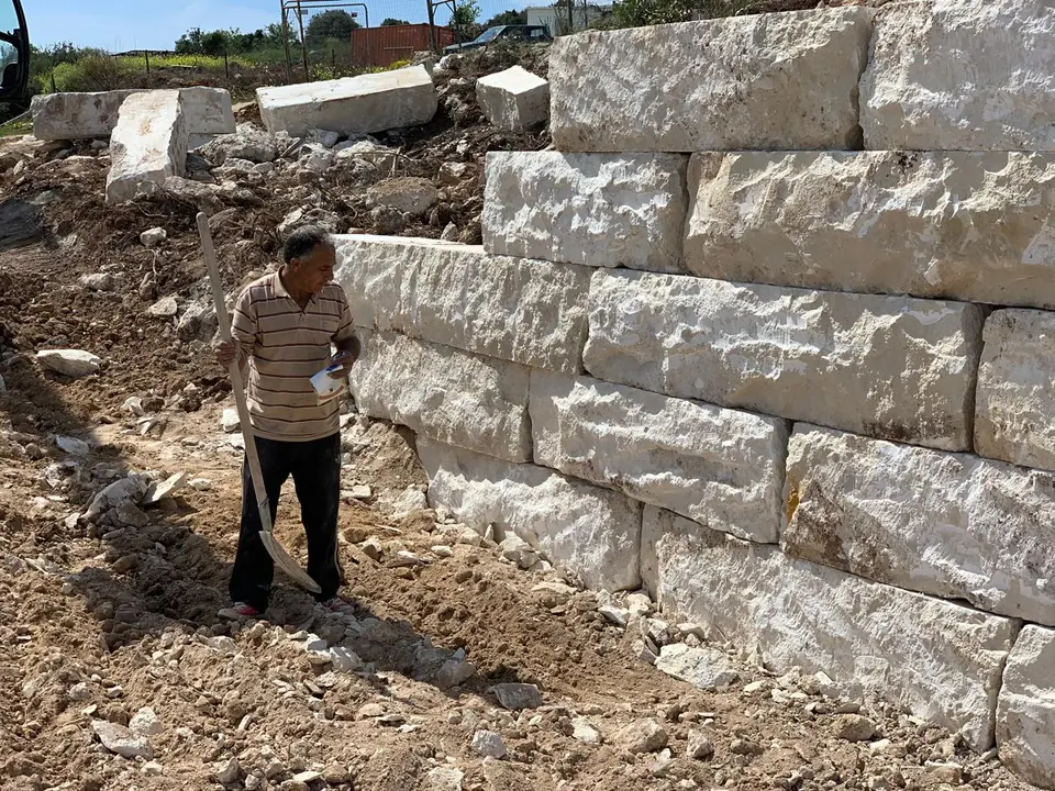 Hillside stone villa, Paphos villages: Limestone block retaining walls